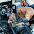 MAF sensor being held above an engine