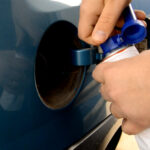 Fuel additive about to be added to a vehicles fuel tank.