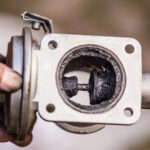 an EGR's internals covered in carbon.