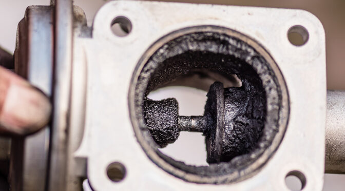 an EGR's internals covered in carbon.
