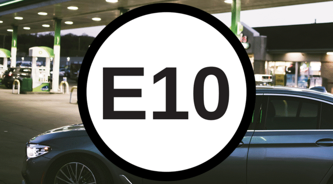E10 in writing over an image of a car in front of a fuel station