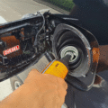 A fuel additive being poured into a vehicle.