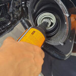 Fuel additive being added to a vehicles fuel tank.