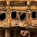 the side of an engine block showing carbon on the internals
