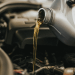 Oils being poured into an engine